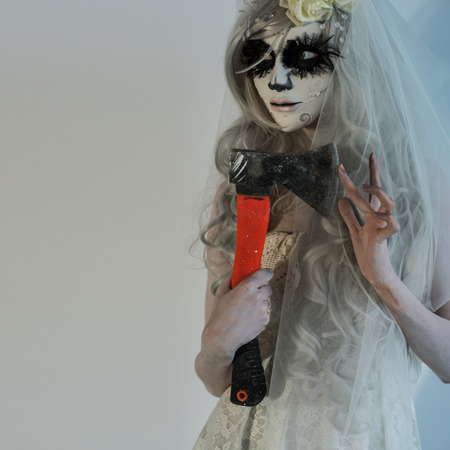 Halloween witch holding axeの写真素材