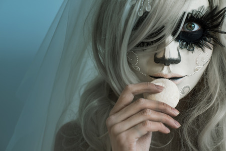 Halloween witch eating candyの写真素材