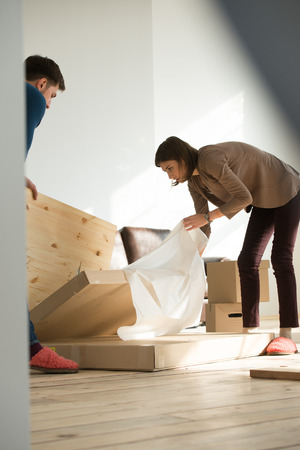 Young couple moving in new houseの写真素材