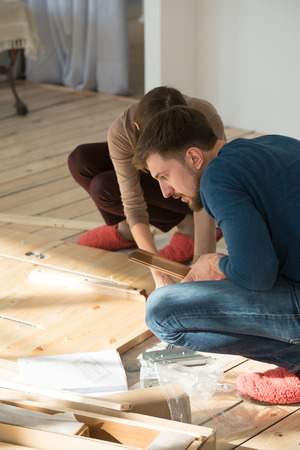 Young couple moving in new houseの写真素材