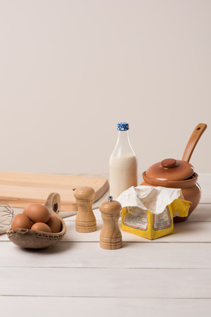 Ingredients for dough on white wooden tableの写真素材