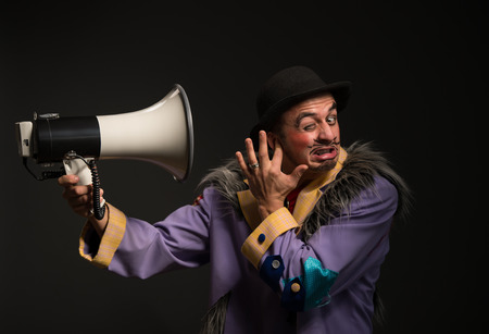 Clown shouting at the megaphone