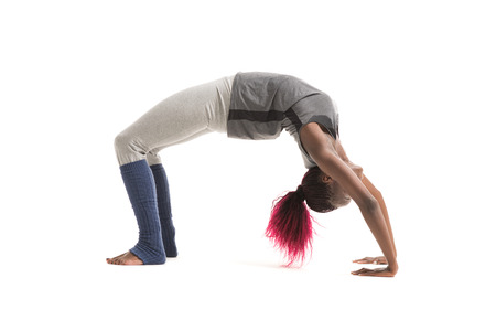 Woman doing yoga indoors isolated on white background