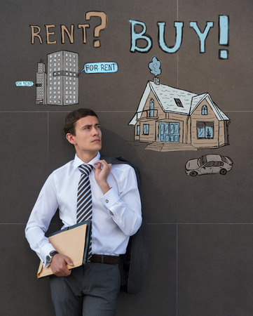 Buy or rent realty. Businessman thinking and choosing, Mortgage conceptの写真素材