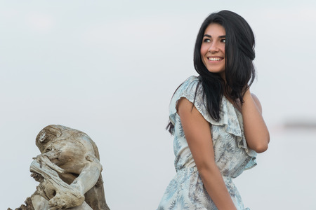 Portrait of the beautiful girl on beach closeup