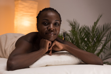Spa African Woman in Beauty Salon Relaxingの写真素材