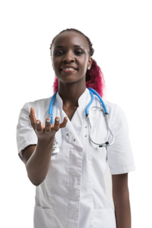 Close up of female african doctor holding something in handsの写真素材