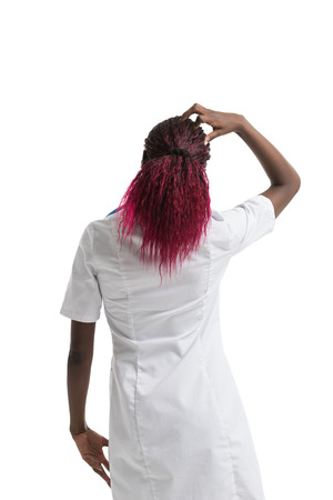 Rear view of medical doctor, woman standing back and thinking wear doctors lab white coat isolated over white backgroundの写真素材