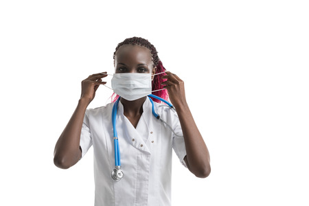 Portrait of african female doctor in mask. Close up shot.の写真素材