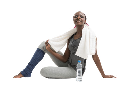 Athletic girl with a bottle of water and towelの写真素材