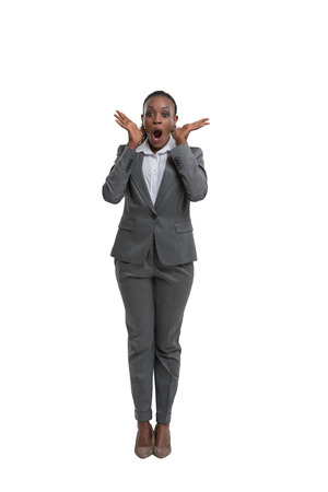 Surprised african business woman portrait isolated on white backgroundの写真素材