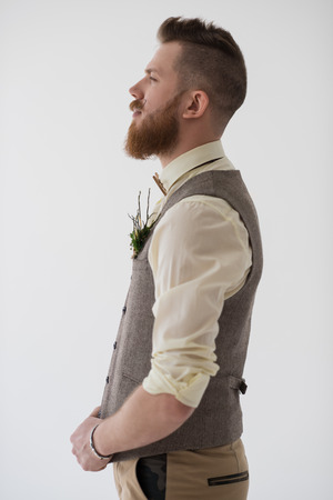 Closeup portrait of modern groom looking serious before his weddingの写真素材