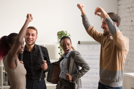 Business team celebrating a good job in the officeの写真素材