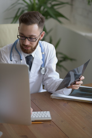 Doctor examining an elbow x-ray. Medicine and healthcareの写真素材