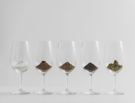 World's most popular addictions in wineglasses. Coffee, Chocolate, Cocaine, Cannabis, Tobacco