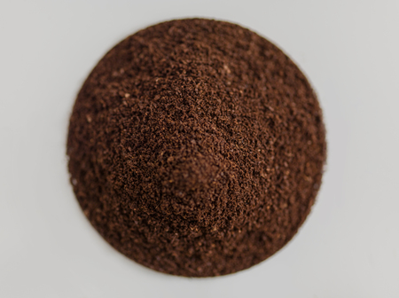 Pinch of Coffee in circle shape on white backgroundの写真素材