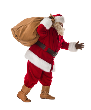 Santa Claus walking with his big bag Full-Length Portraitの写真素材