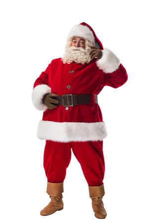 Santa Claus talking by phone Full Length Portrait. Isolated on White Backgroundの写真素材