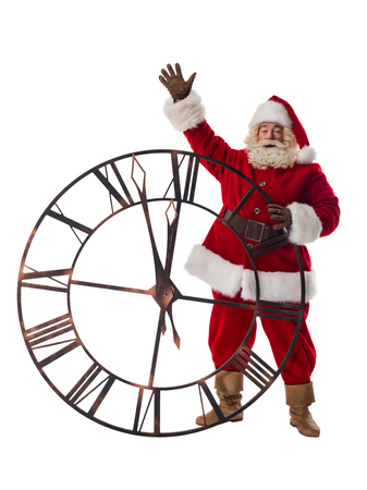 Santa Claus posing with big watches Full Length Portrait Isolated on White Backgroundの写真素材