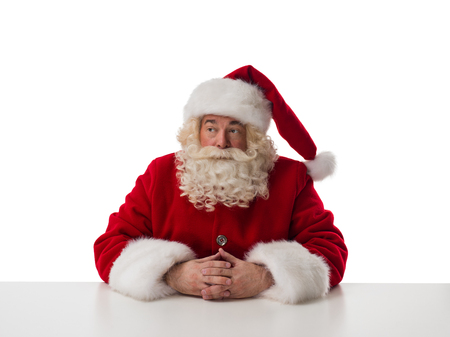 Santa Claus thinking Closeup Portrait Isolated on White Backgroundの写真素材