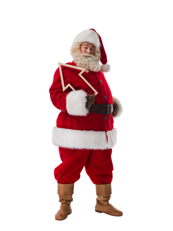 Santa Claus holding wooden arrow and showing direction Full Length Portrait isolated on White Backgroundの写真素材