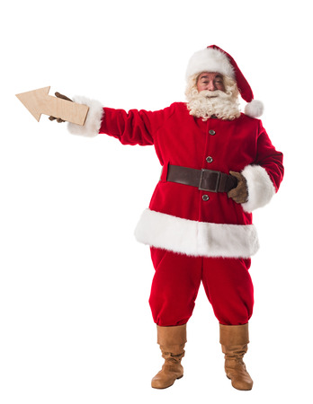 Santa Claus holding an arrow Full Length Portrait Isolated on White Backgroundの写真素材