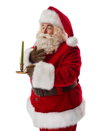 Santa Claus holding candle Closeup Portrait isolated on White Backgroundの写真素材