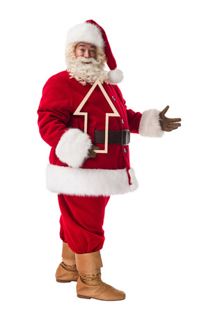 Santa Claus holding an arrow Full Length Portrait Isolated on White Backgroundの写真素材