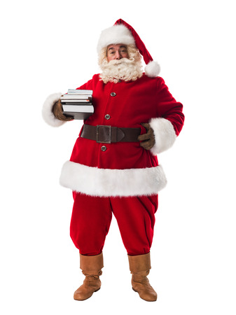Santa Claus holding pile of books Full Length Portrait Isolated on White Backgroundの写真素材