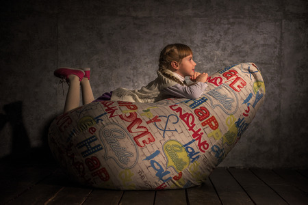 Girl Resting on Beanbag at homeの写真素材