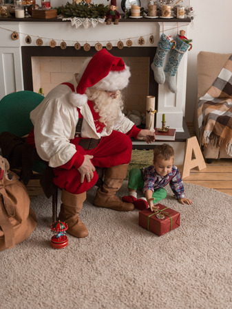 Santa Claus with Child at Homeの写真素材