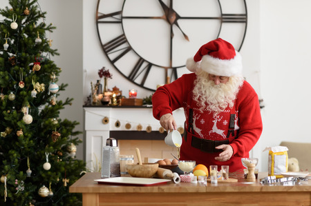 Santa Claus Cooking at Home Christmas Cookiesの写真素材