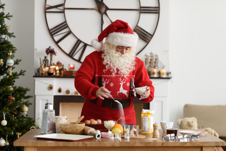 Santa Claus Cooking at Home Christmas Cookiesの写真素材