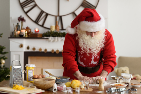 Santa Claus Cooking at Home Christmas Cookiesの写真素材