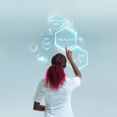 Medical doctor working with modern medical icons. Modern and future medical technology conceptの写真素材