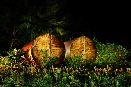 2 rusted oil tank shot using 'painting with light' techniqueの写真素材
