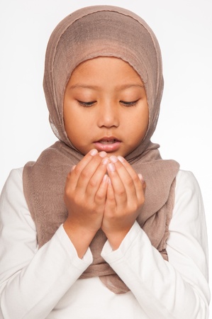 A Malay little girl wearing head scarf as an islamic attireの写真素材