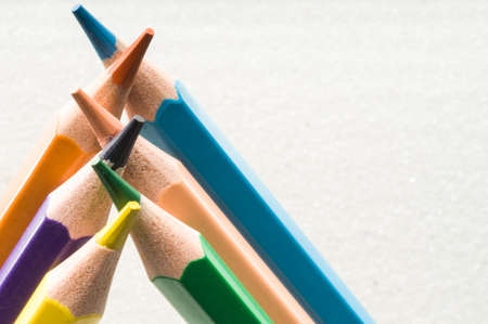 A group of colorful pencils in white background with copy / text spaceの写真素材