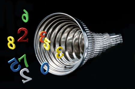 Conceptual image of a spiral of colorful numbers on black backgroundの写真素材