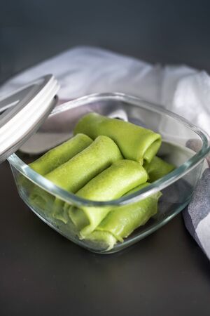 Malaysian's local food , Kuih Lenggang or Kuih Ketayap on glass containerの写真素材