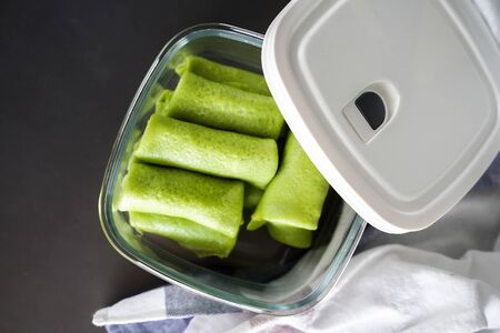 Malaysian's local food , Kuih Lenggang or Kuih Ketayap on glass containerの写真素材