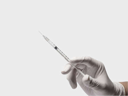 Injection vaccine or insulin via syringe in actionの写真素材
