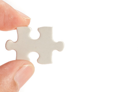 finger and puzzle, isolated on whiteの写真素材