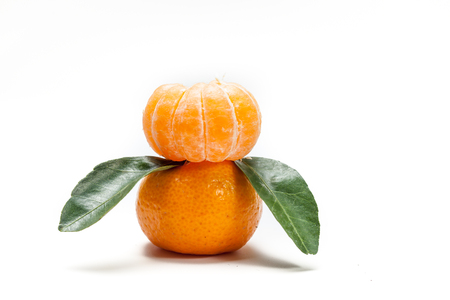 orange tangerine or Mineola with slices and leaf isolated white backgroundの写真素材