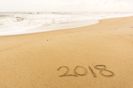 2018 written on the beach sand.new year conceptの写真素材
