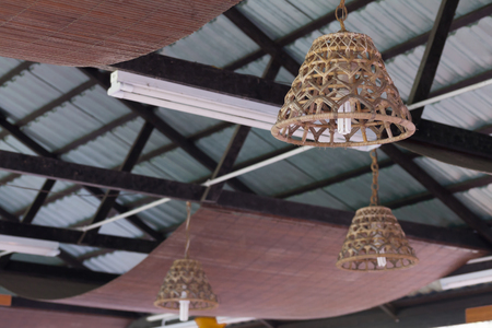 Decorating hanging  lamps in wooden wicker made from bambooの写真素材