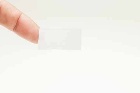 white sticker note stick to finger