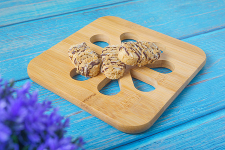 Cookies for eid mubarak celebration on wooden background. Muslim festival