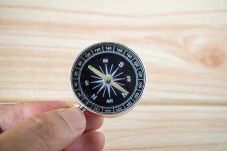 old dusty compass on handの写真素材