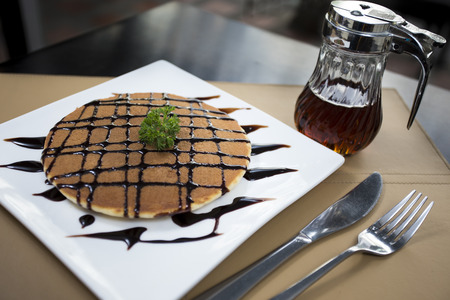Pancake with honey syrup and Chocolate sauceの写真素材